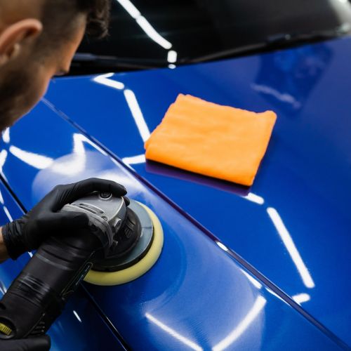 car polishing with orbital polisher for scratch removal and paint correction in sarasota florida